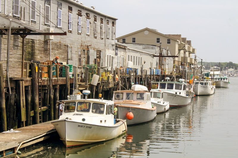 A row of boats docked in Portland, Maine, considered one of New England's best places to visit