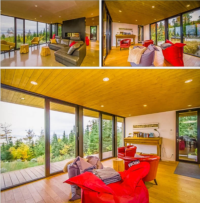 Modern living room with forest views.