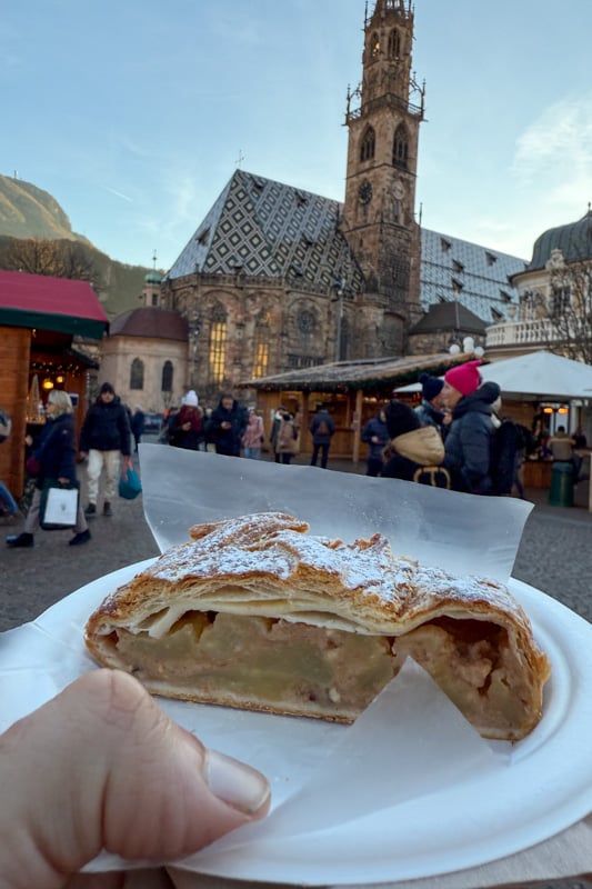 My photo of me eating an apple strudel at Bozen's Christmas Market