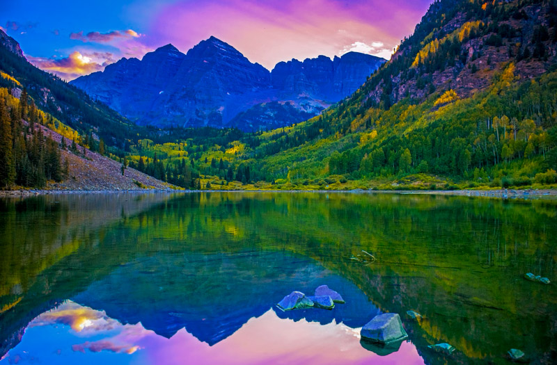 Nature's masterpiece: Rocky Mountain sunset paints over serene Maroon Bells, Colorado