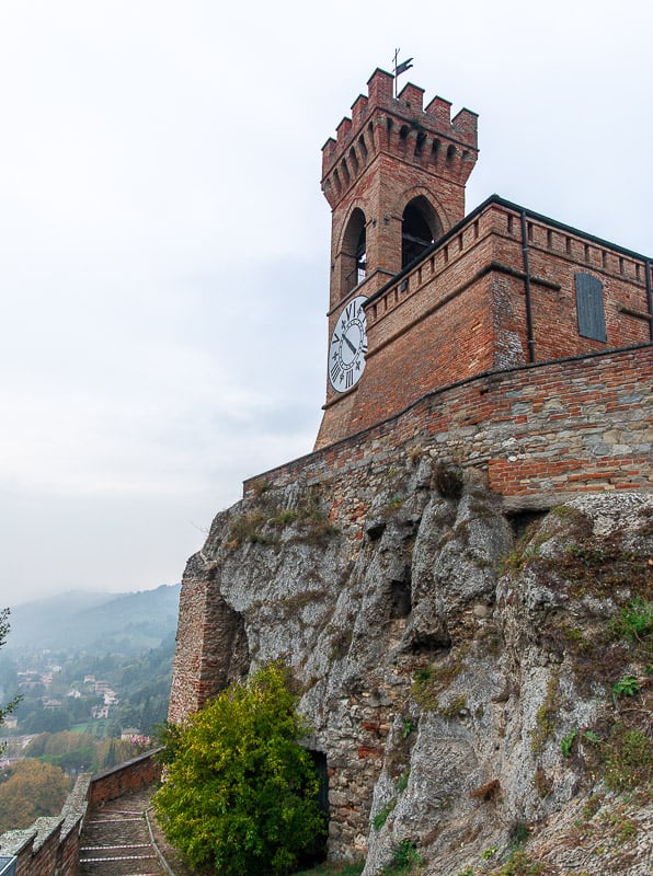 Majestic clock tower standing tall on a hill, overlooking the city below