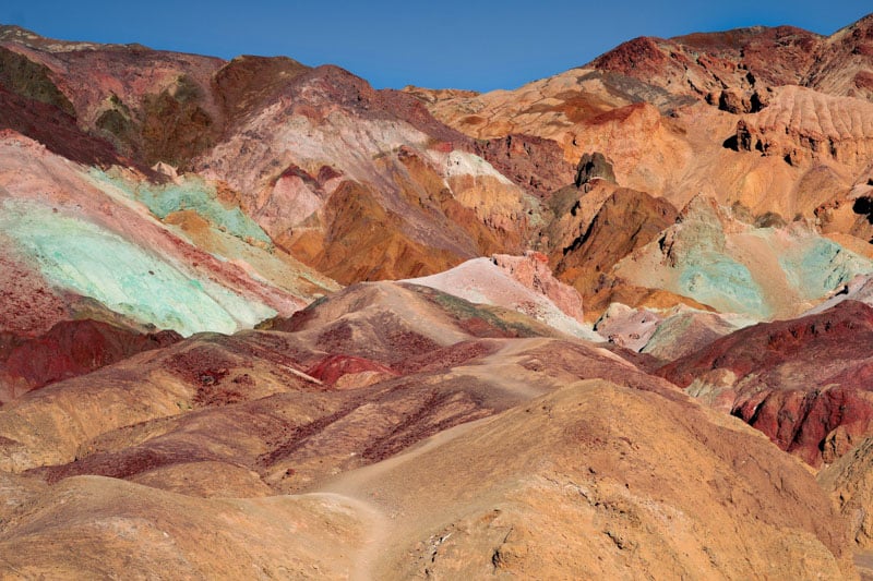 Death Valley National Park boasts extreme landscapes with salt flats, sand dunes, and colorful badlands.