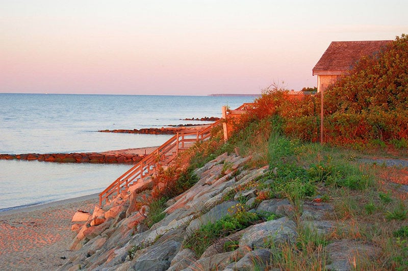 Dennis Port coastal charm, sandy shores, and seaside relaxation attracts visitors