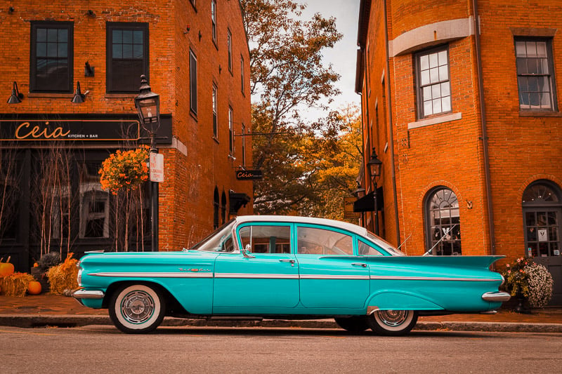 A vibrant turquoise 1955 Chevrolet Bel Air captured in a photograph