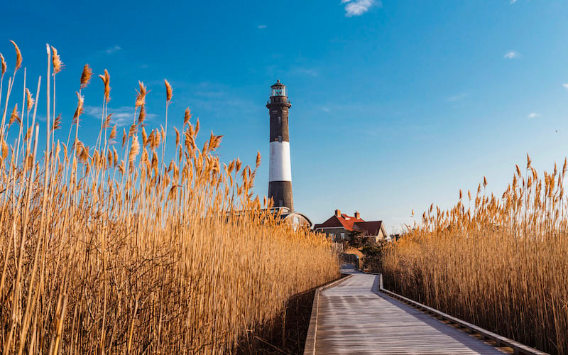 Fire Island is a serene barrier island off New York, offering sandy shores, dunes, and a tranquil atmosphere.