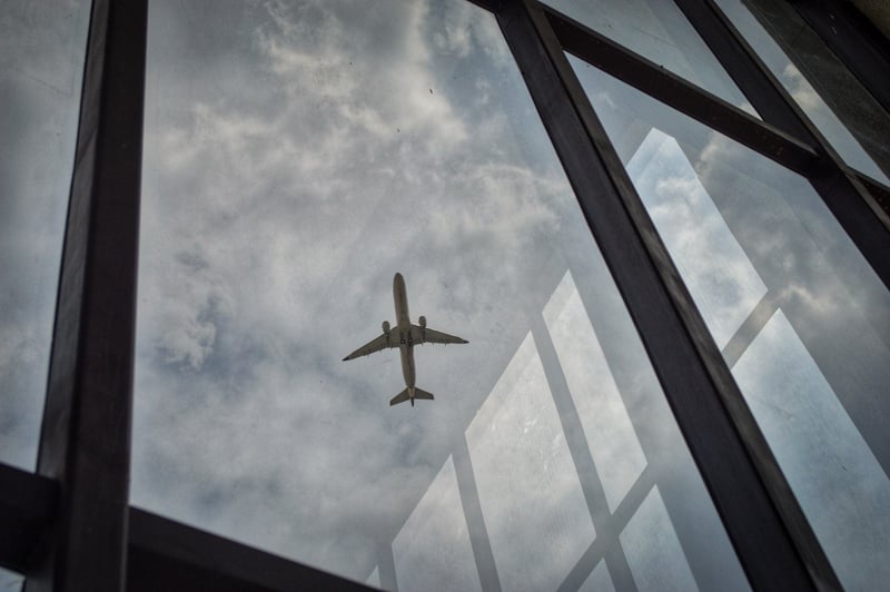 Airplane flying over a building