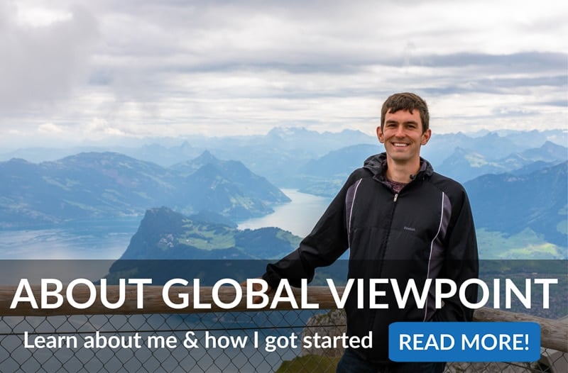 Jon enjoying the view from a mountain peak with written words about Global Viewpoint