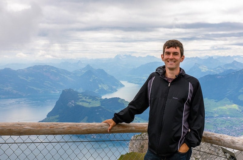 Jon enjoying the view from a mountain peak