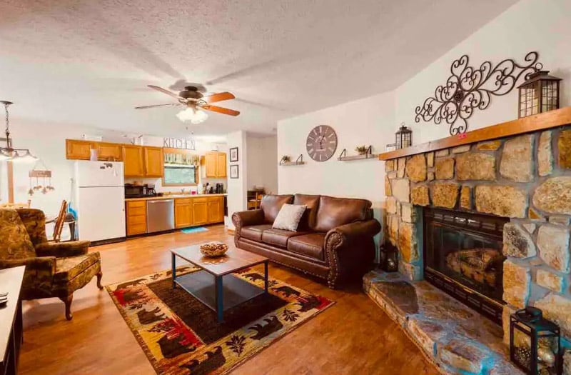 Step inside this cozy cabin and relax by the gas fireplace, surrounded by warm wood tones and beautiful mountain views