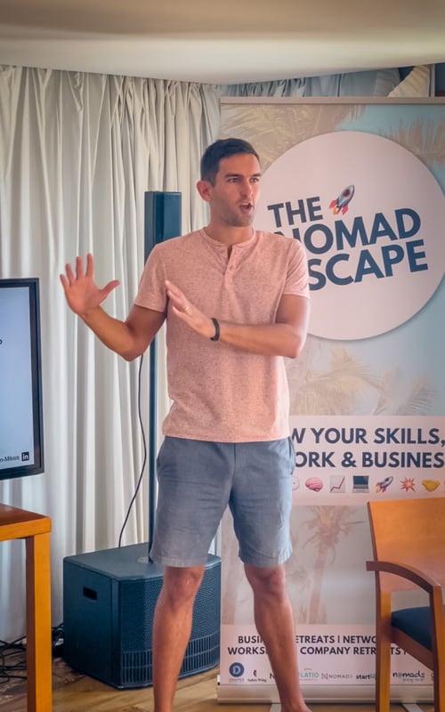 Jon giving a presentation on travel blogging to digital nomads