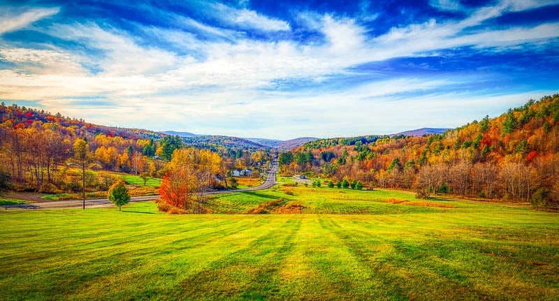 Scenic golf course in the green mountains on a sunny autumn day