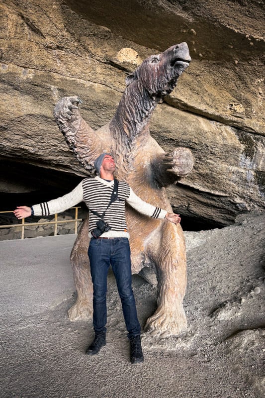 Me standing next to a statue of a Milodon