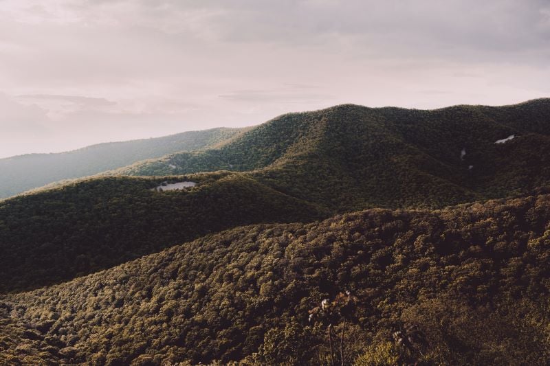 A vibrant sunset over Shenandoah National Park, casting a warm glow over the landscape