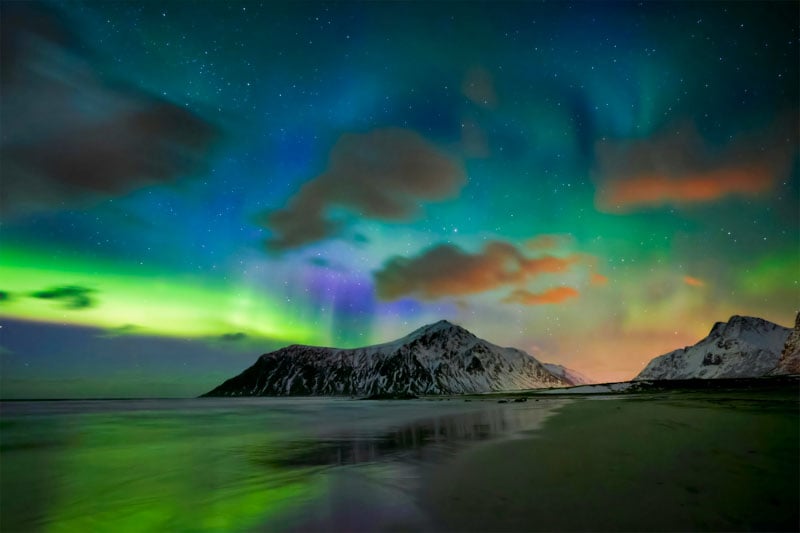 Witnessing the Northern Lights in Scandinavia is one of the transformational travel experiences that will change your life.