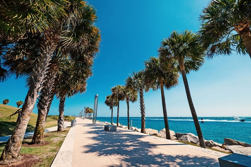 Stroll along the serene promenade at South Pointe Park.