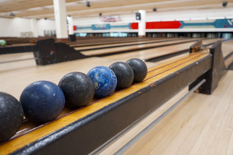 Image showing bowling balls lined up at South Boston Bowling.