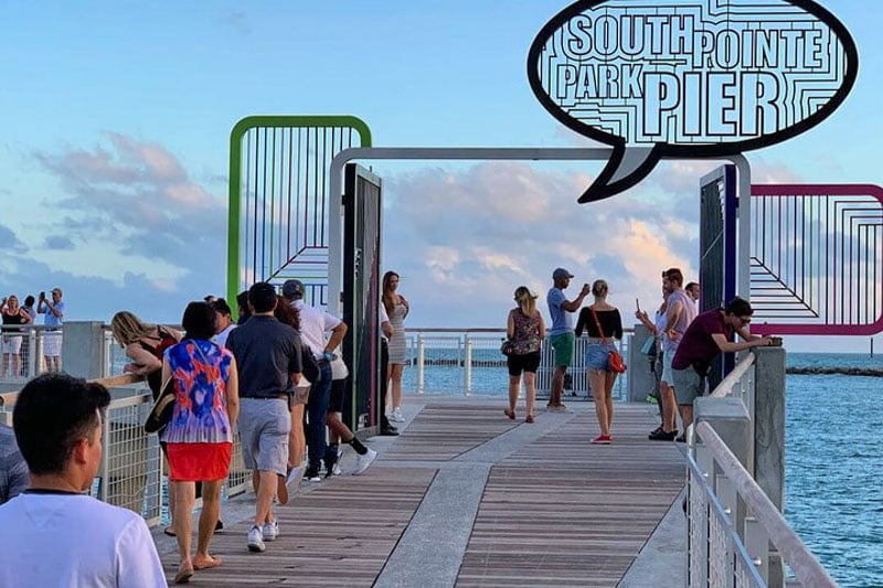 Visit South Pointe Park Pier at night for stunning panoramic views of the Atlantic Ocean.