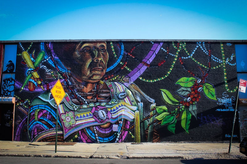 The Bushwick Collective: Vibrant open-air art gallery near Manhattan in Brooklyn. Colorful murals, graffiti—a fun and creative activity.