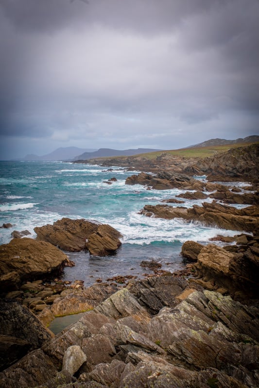 Rocky coastline of the Isle of Man: Majestic cliffs and rugged terrain meet the crashing waves