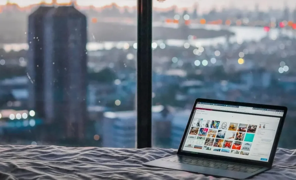 Laptop on a bed